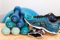 running shoes and dumbbells