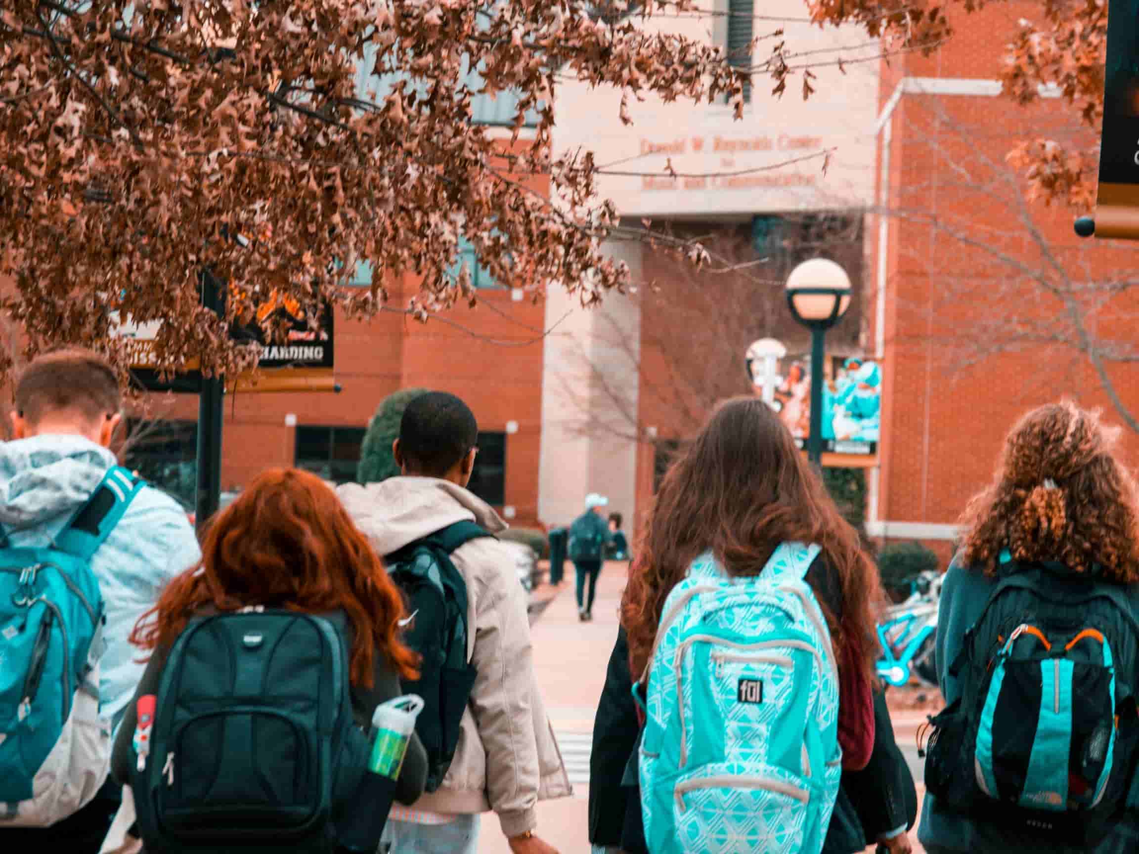A group of college students walk to class