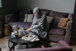 Middle eastern woman looking up something on her laptop