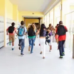 friends running down school hall