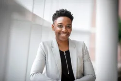 Portrait of a black female business woman looking at the camera and smiling