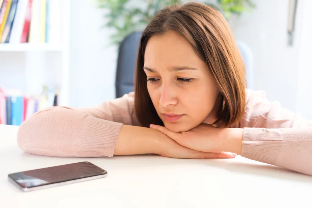 Angry girl waiting for a mobile phone call