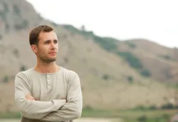 Handsome man outdoors man with crossed arms