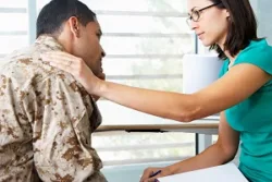 counseling is a partnership woman putting hand on man's shoulder