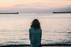 woman staring out at water