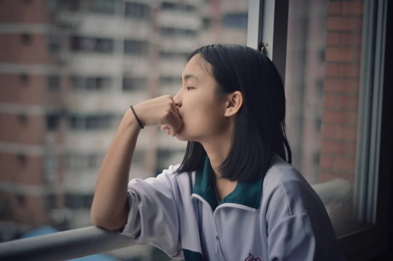 child looking out of window