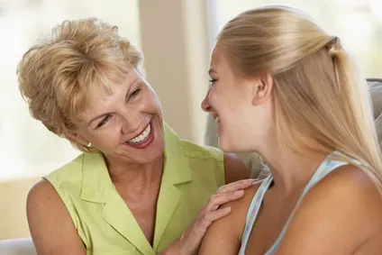 daughter and mother smiling