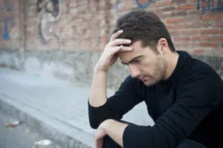 man thinking outside while sitting