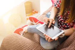 teenage woman using tablet