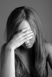 disappointed woman hiding her eyes