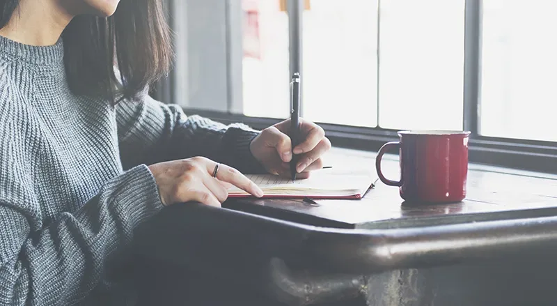 lady writing in diary