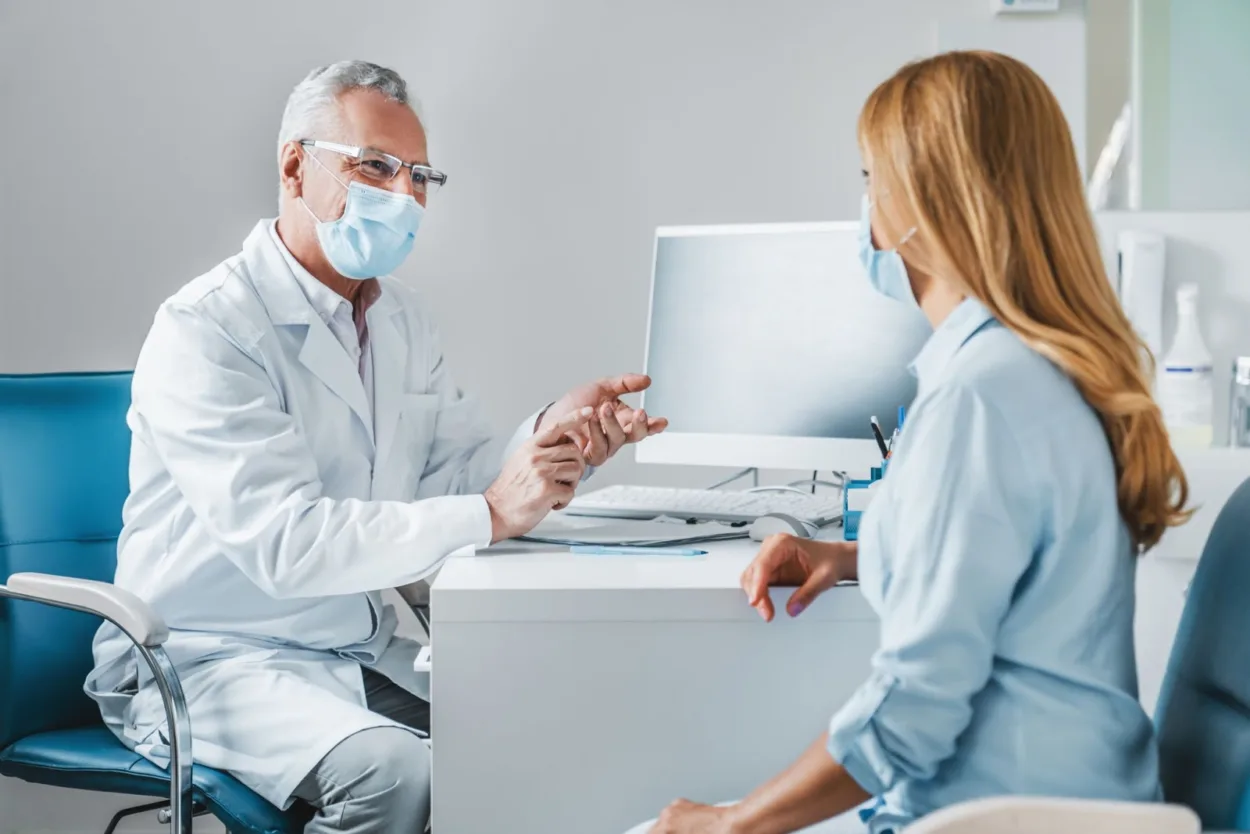 A doctor going over a procedure with a female patient