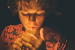 man lighting cigarette and smoking