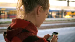 teenager checking her phone