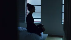Cognitive Behavioral Therapy for Insomnia A woman with insomnia sitting on her bed awake