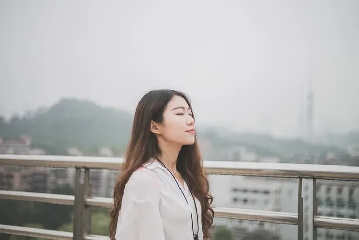 A woman enjoys nature as a form of self-care