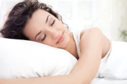 woman lying down in bed