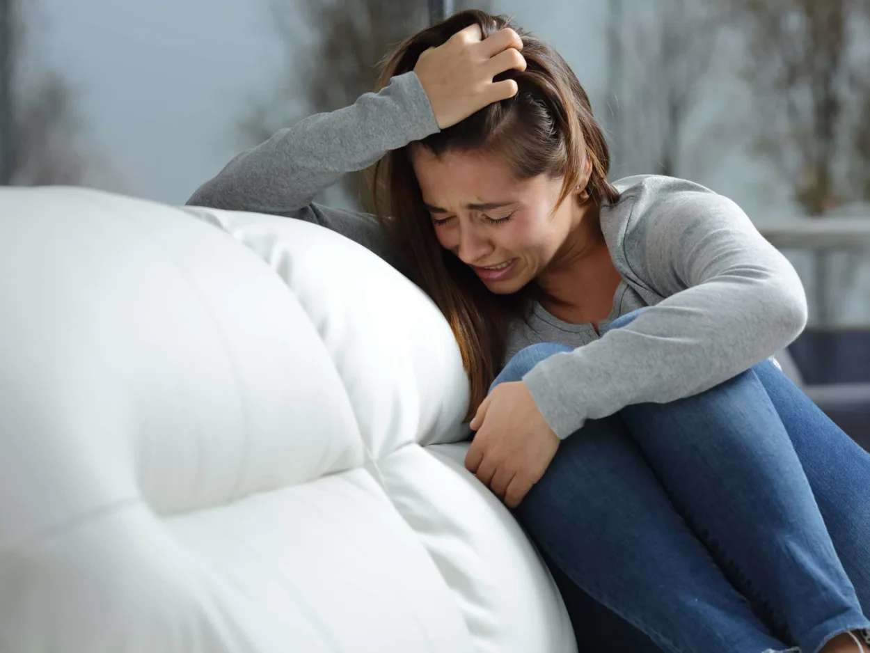 Crying woman who struggles with self-harm