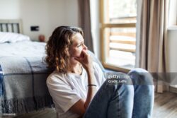 young-adult-woman-with-depression-sitting-at-home-alone-stockpack-gettyimages Young adult woman with depression sitting at home alone
