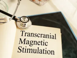 Transcranial Magnetic Stimulation TMS is shown on a photo using the text