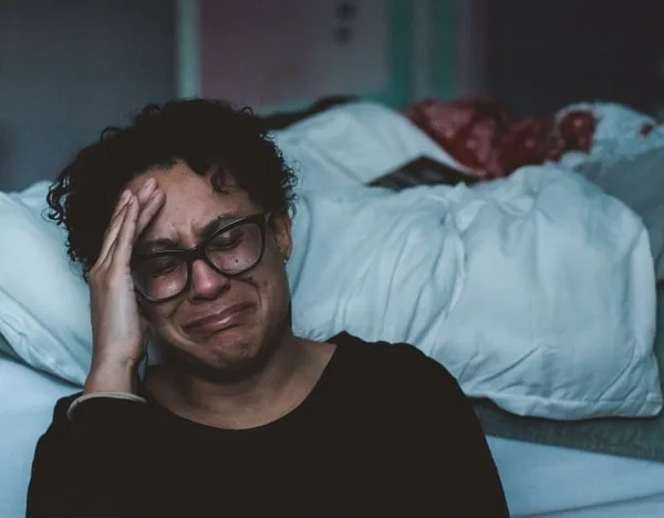 woman crying while coping with loss