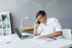 man speaking on phone and smiling