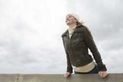 Woman enjoying a breezy day outdoors